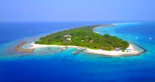 Daytime drone island view of a paradise sunny white sand beach and turquoise sea background in color