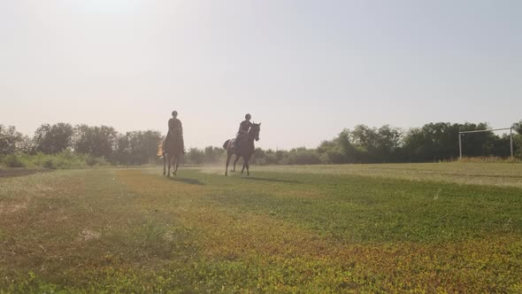 Training of Two Horse Riders Preparing for Racing