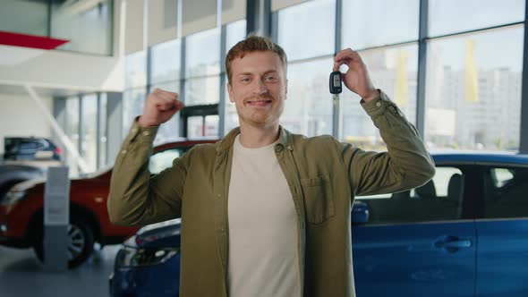 Portrait of a Happy Man with Car Keys in His Hands