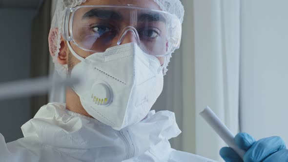 Portrait Arabic Hispanic Man Doctor Medical Worker in PPE Protective Suit Performed Congestion Swab