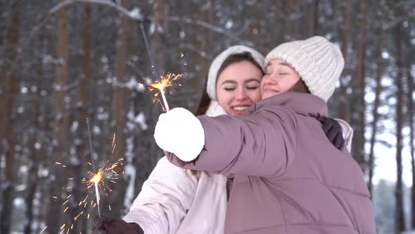 Two Teenage Girl Friends Holding Sparklers