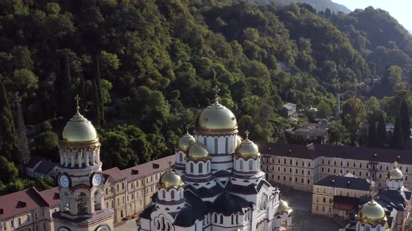 Aerial Around Shot Traditional White Religious Building Monastery with Golden Dome