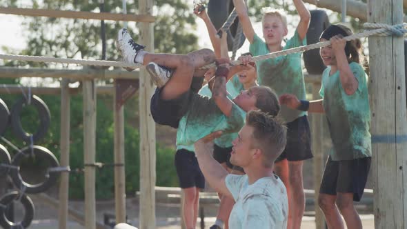 Group of Caucasian children training at boot camp