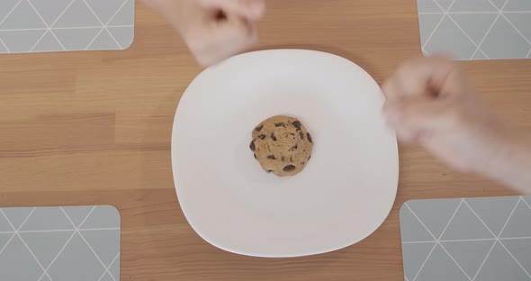 Hands of Two Little Boys Playing Rock-paper-scissors To Win the Last Cookie on Plate, Unrecognizable