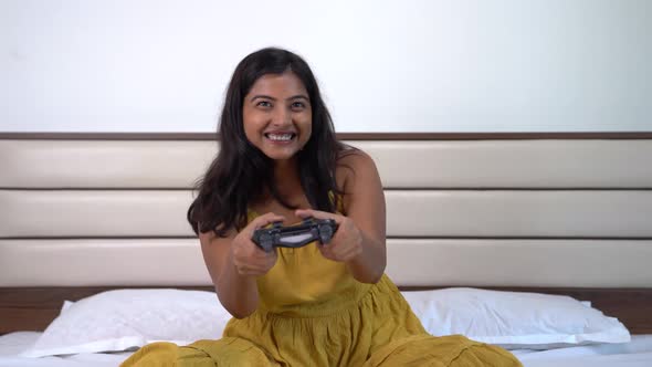 Happy Indian gamer girl