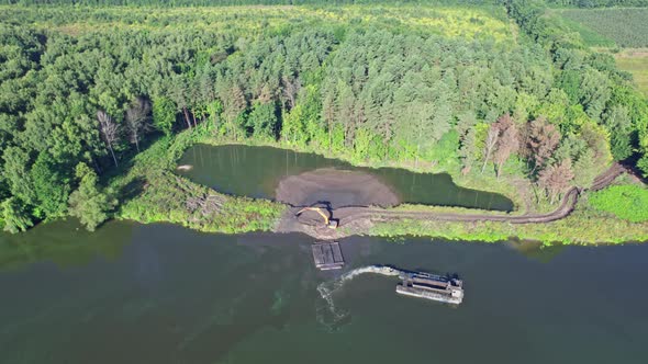 The Dredger Unloads Sand Onto the Shore