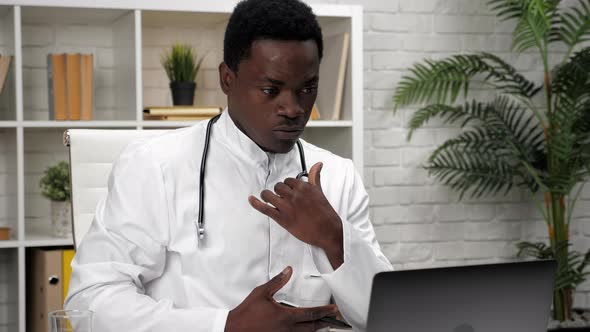 African American Man Online Doctor Talking to Patient Video Call Webcam Laptop