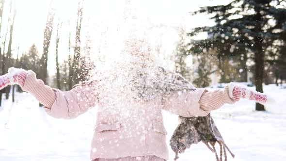 Woman Blows Snow
