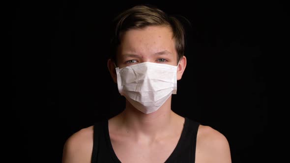Boy Feeling Sick and Wearing Mask