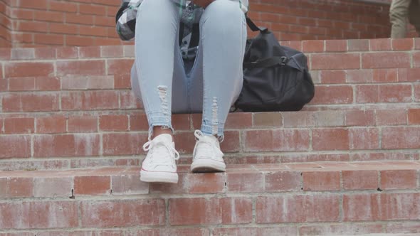 Student high school girl listening to music