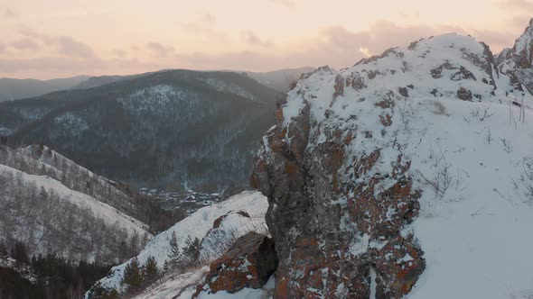 The national park Krasnoyarskie Stolby The Krasnoyarsk Pillars The Red Ridge rock Winter
