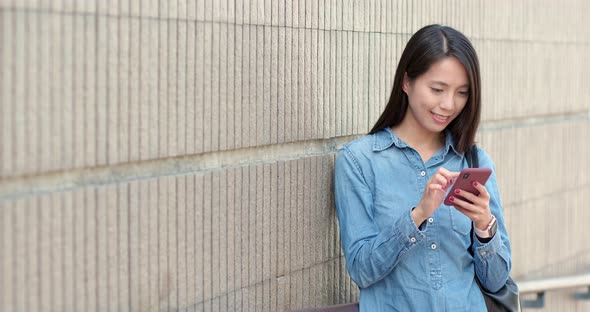 Woman Use of Mobile Phone in City