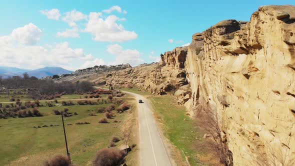 Tracking View Car On Road Drives In Spring With Beautful Panorama