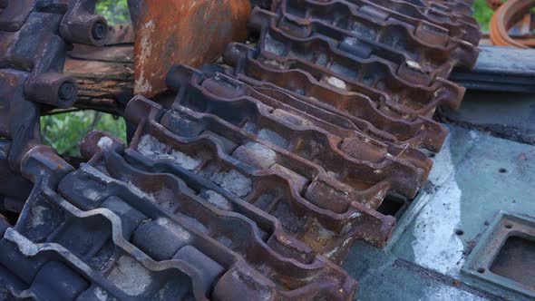 Top View Closeup of Burnt Down Destroyed Tank Caterpillar Outdoors in Ukraine