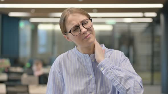 Portrait of Young Woman Having Neck Pain