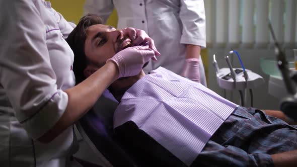 Dentist Making Cast of Patient's Teeth in Clinic