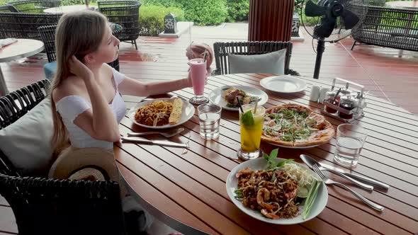 Lonely Upset Woman Sit By Table with Food in Restaurant Wait Friend Husband