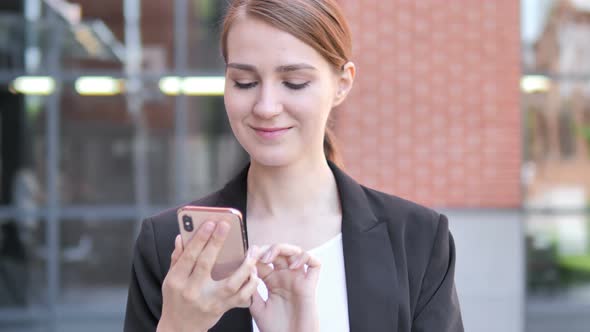 Outdoor Young Businesswoman Using Smartphone