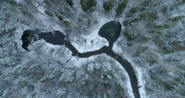 Natural Phenomenon Holy Water Springs in Snowy Winter Forest Aerial View