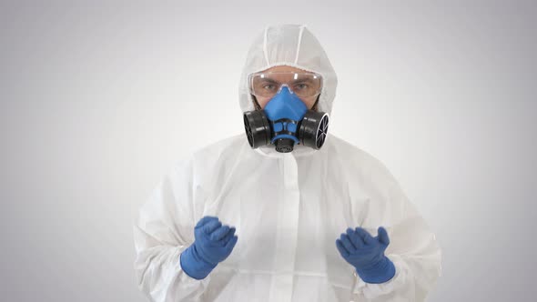 Doctor in Hazamat Protective Suit Dancing in a Funny Way Covid-19 Concept on Gradient Background