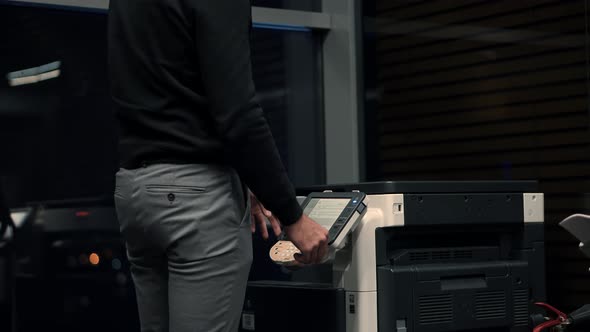 Businessman Working In Office And Preparing Documents For Signature. Man Using Printer Or Scanner.