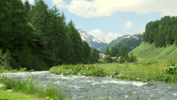 Mountain Landscape with Clouds and River at Alpe Devero in Devero Valley Piemonte Italy