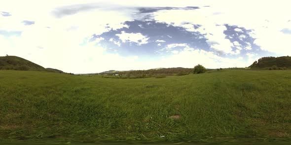 360 VR of a Beautiful Mountain Meadow Timelapse at the Summer or Autumn Time. Clouds, Green Grass