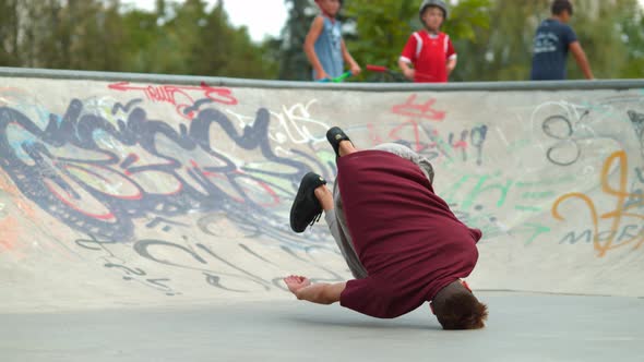 Man doing a head spin, slow motion alt
