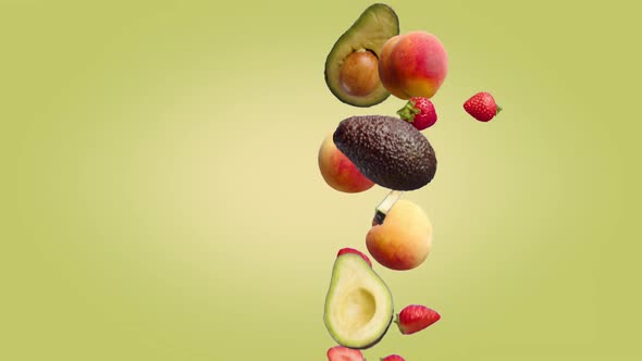 Peach Avocado and Strawberry Fruits Fall on a YellowGreen Background