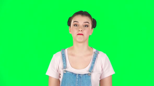 Trendy Girl Poses for Camera Makes Funny Faces on Green Screen at Studio, Slow Motion