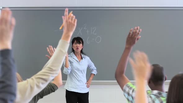 High school teacher teaching maths class