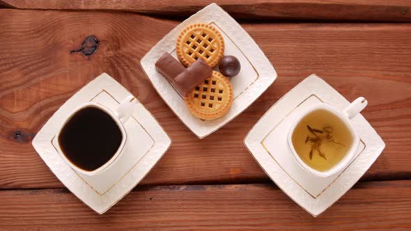 Coffee or tea choice Steaming hot drinks cups with sweets Espresso and herbal mix Cookies chocolate
