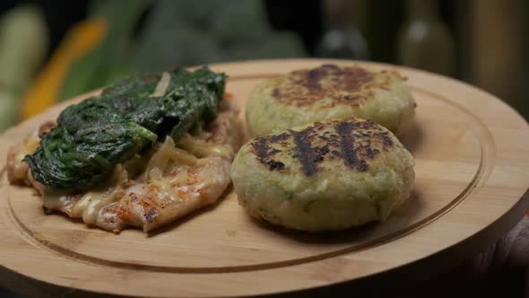 Serving Chicken Steak with Veggies on the Board