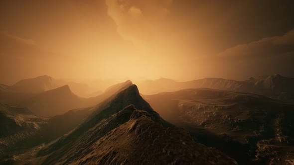 High Mountain Peaks Covered with Dramatic Heavy Fog alt