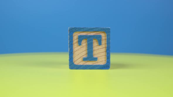 Close up shot letter "T" alphabet wooden block