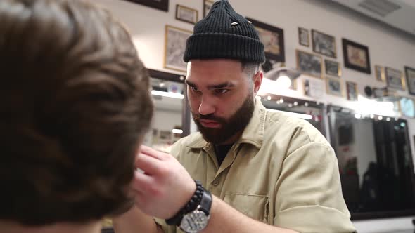 Men's Haircut. Stylish Hairdresser Cuts a Man.