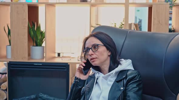 Focused Business Woman Talking on Mobile Phone at Home Office in Slow Motion