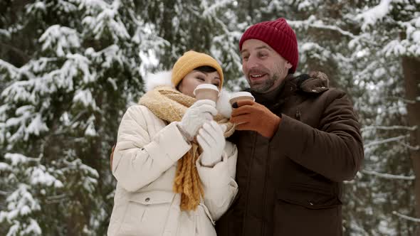Couple Having Hot Beverage in Winter