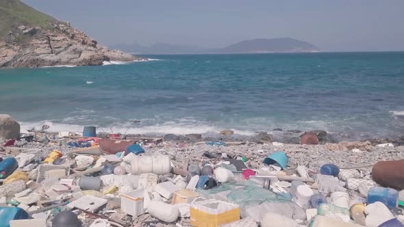 Environmental impact of Beach covered in plastic and rubbish in Hong Kong. Aerial drone view