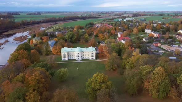 Autumn Aerial Landscape of the City Mezotne and Palace With Park Near Lielupe River, Latvia 4K Video