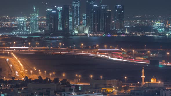 Construction of New Skyscrapers in Dubai Creek Harbor Aerial Night Timelapse