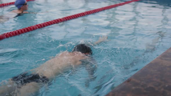 Man Practicing his Strokes in Pool