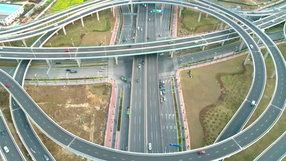 Top View To the Cars Driving on Multi-level Highway on the Sunset. Highway Multilevel Junction Road