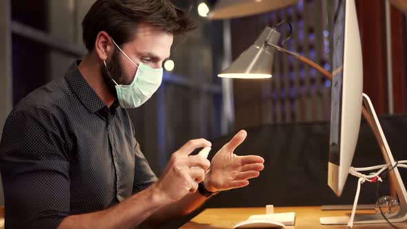 Cleaning And Disinfection Hands In Office.Coronavirus Covid19.Man Using Sanitizer.Face Mask