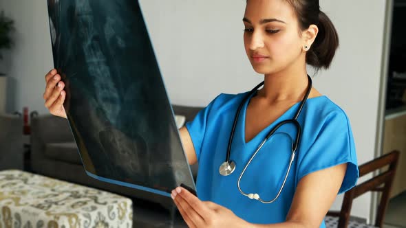 Female doctor examining x-ray