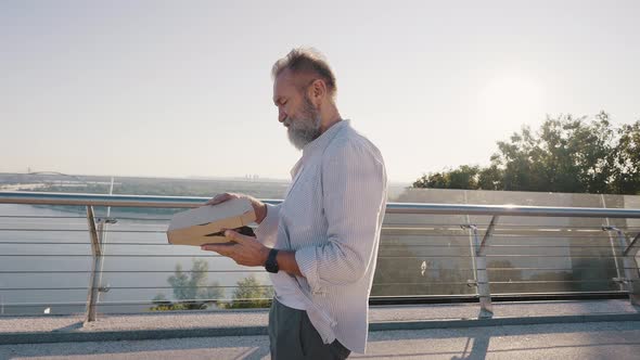 Bearded Pensioner Rides Electric Unicycle Eating Pizza