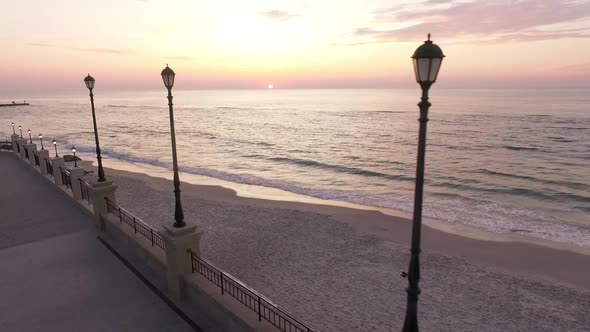 Footage From Drone Slomo Magnificent View Over Empty Seaside and Embankment with Flying Bird on