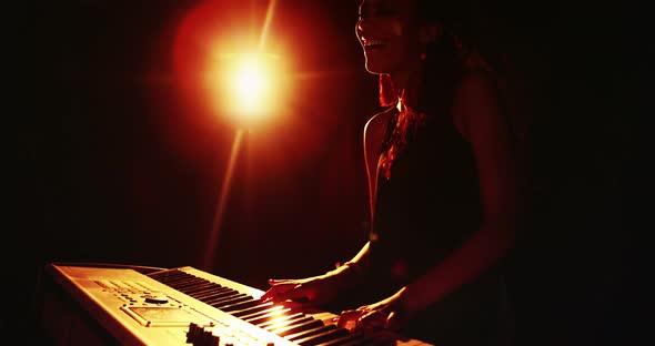 Woman playing electronic keyboard 4k