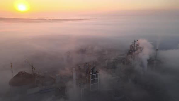 Aerial View of Cement Factory with High Concrete Plant Structure and Tower Crane at Industrial