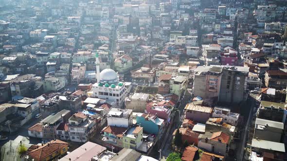 Drone view on poverty slum district and muslim mosque